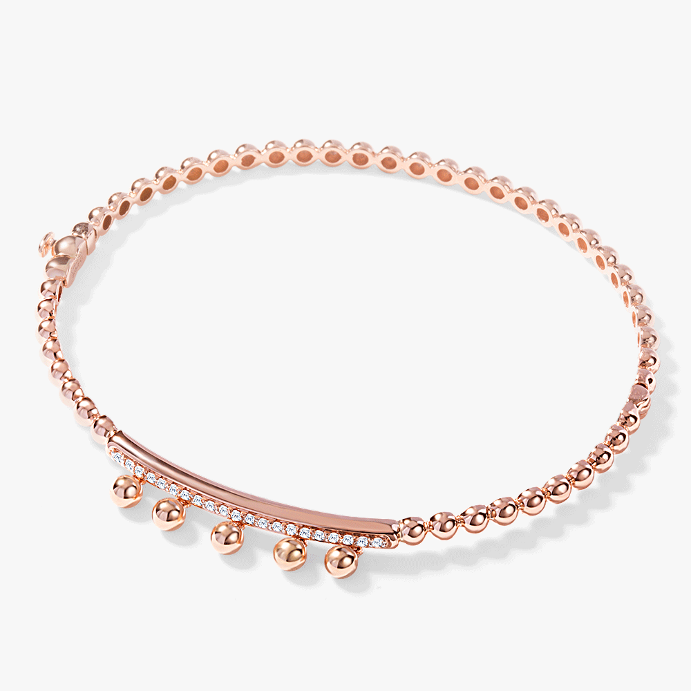 Oubharia essentia dangling spheres bangle in 18k rose gold with diamonds